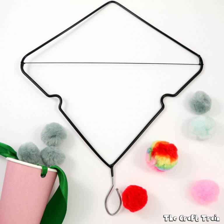 Coat hanger catapult craft: Make a simple catapult by upcycling a wire coat hanger. This is a fun STEAM activity for kids which also makes a great DIY toy.