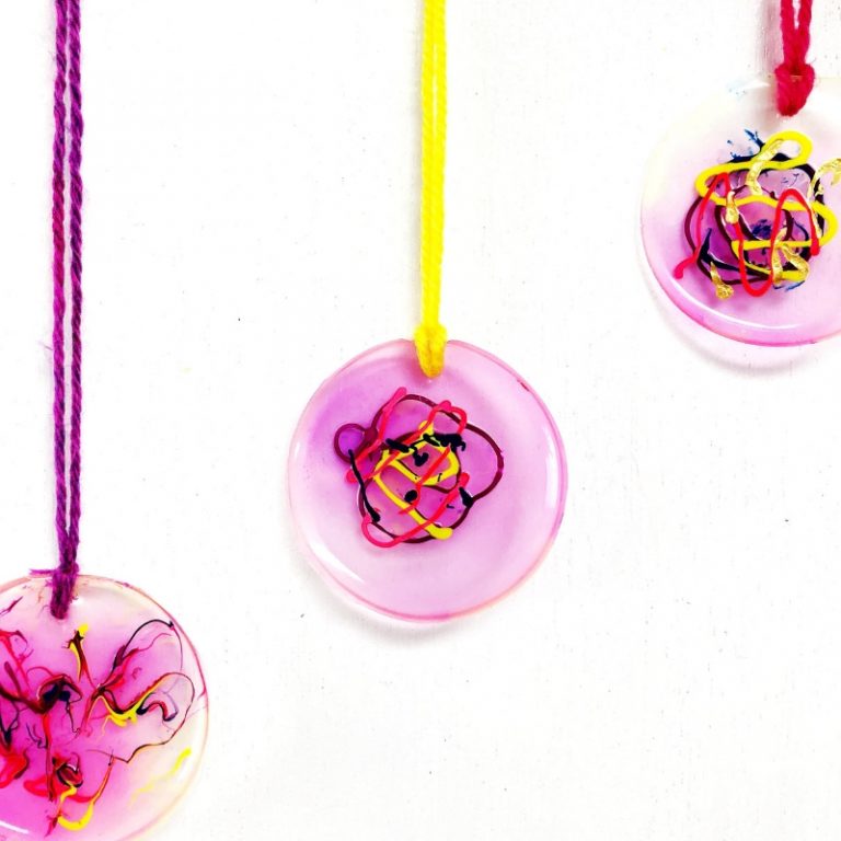 Kid made necklaces with glue and paint. This would make a great DIY gift idea for somebody special! By Oh Creative Day for The Craft Train #handmadegifts #kidscrafts #jewellery #kidmade