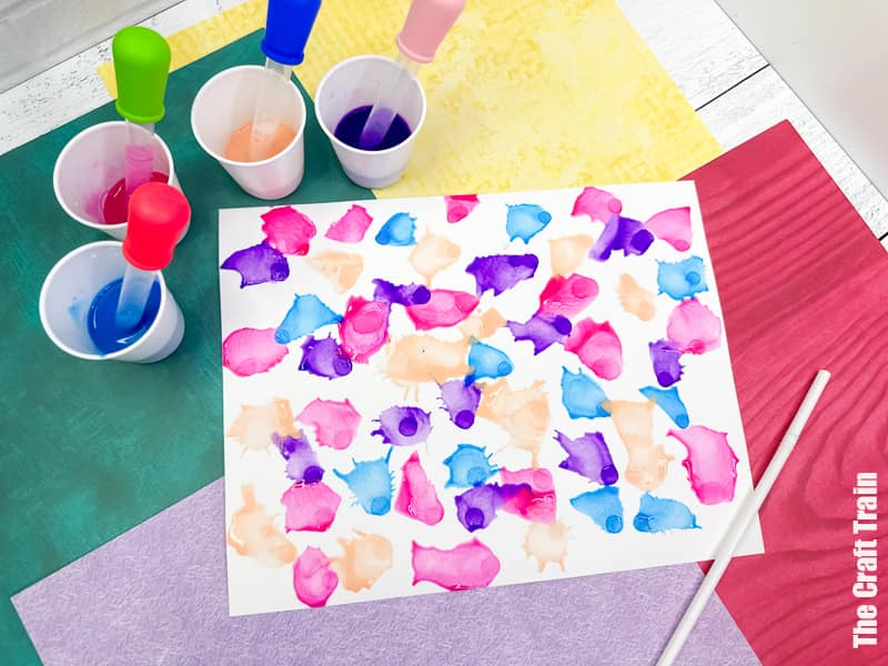 Straw Painting process art idea for kids. Blow paint across page using eye droppers and straws