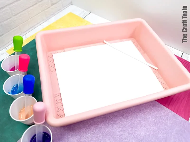 Straw Painting process art idea for kids. Blow paint across page using eye droppers and straws