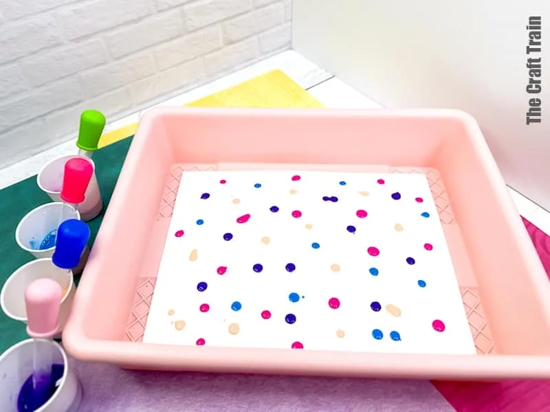 Straw Painting process art idea for kids. Blow paint across page using eye droppers and straws