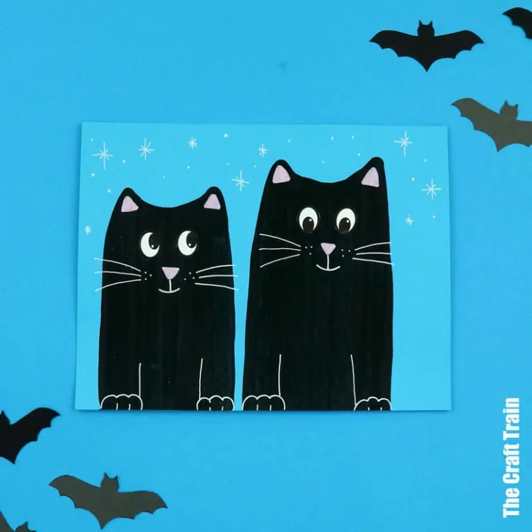 Black cat scrape art for Halloween. Use a craft stick and strategically squirted paint to make gorgeous black cat artwork