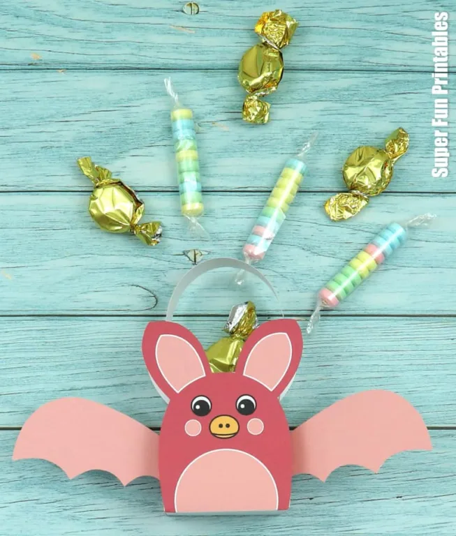 Pink rainbow bat with candy