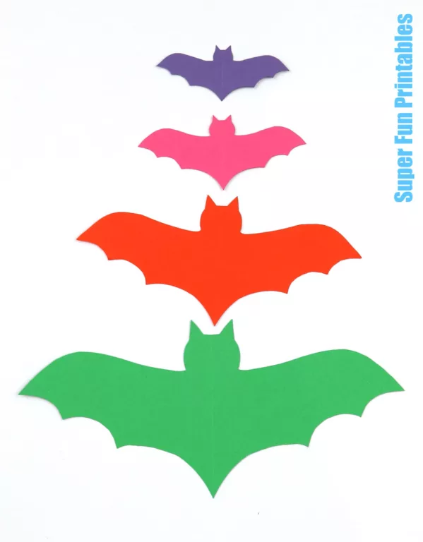 Bat templates in symmetrical fold-and-cut style for Halloween crafting