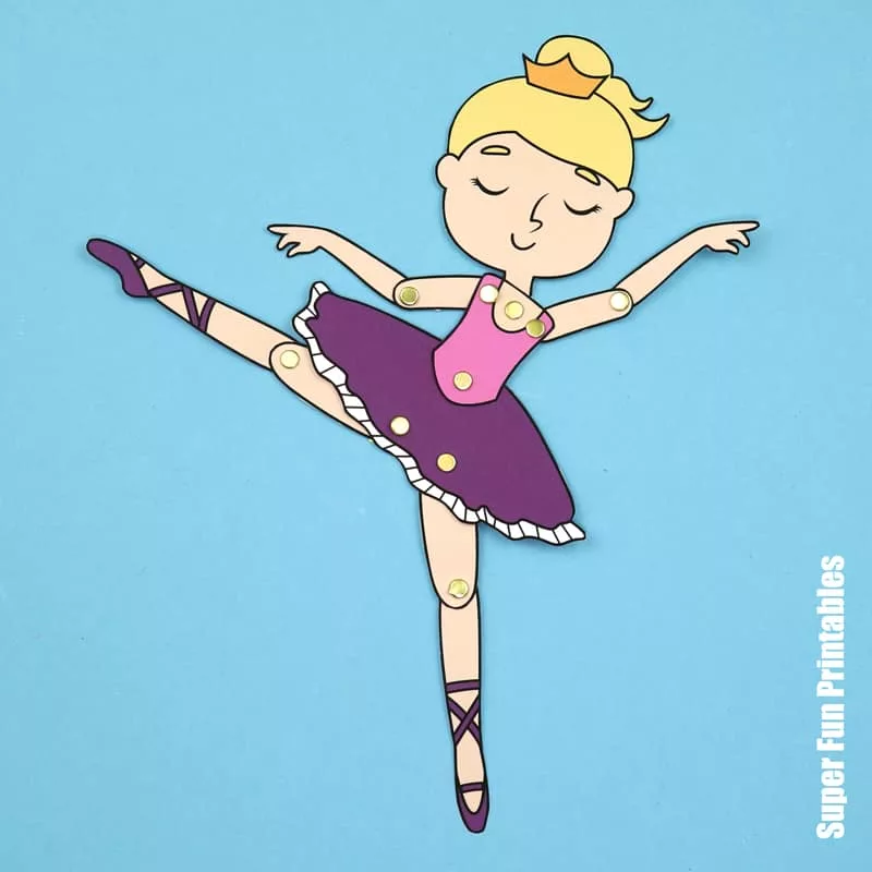 Pallerina paper doll in dancing pose with pointed toes