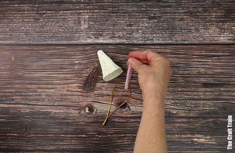 Steps to make egg carton Christmas tree - thread ornament string through the top hole