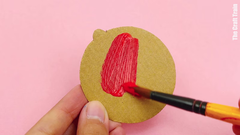 Steps to make cardboard shape decorations. Paint the shapes