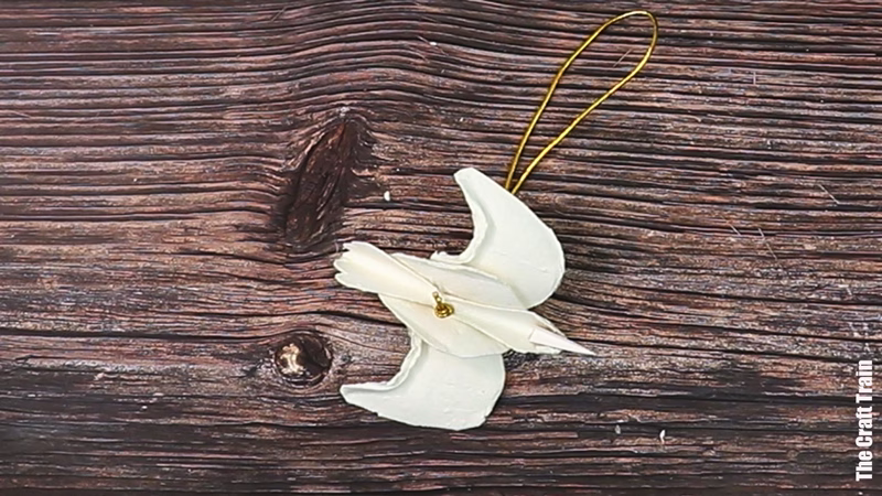 Dove egg caraton ornament, photographed upside down