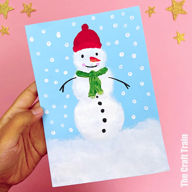 Sponge painted snowman art activity for kids with Q-tip snow
